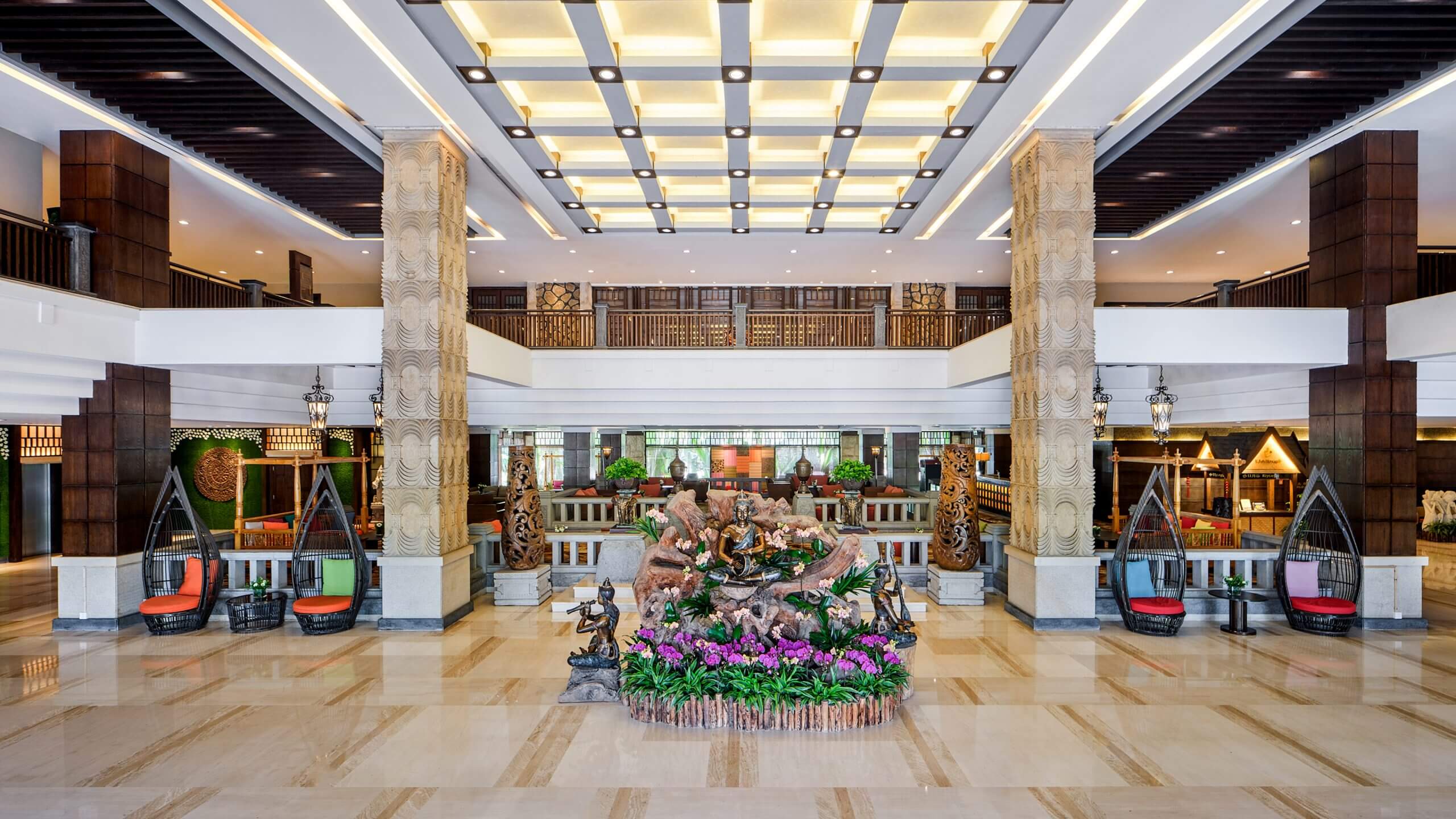 View of the lobby area featuring a spacious open atrium in Riyuegu Hotsprings Hotel in Xiamen.