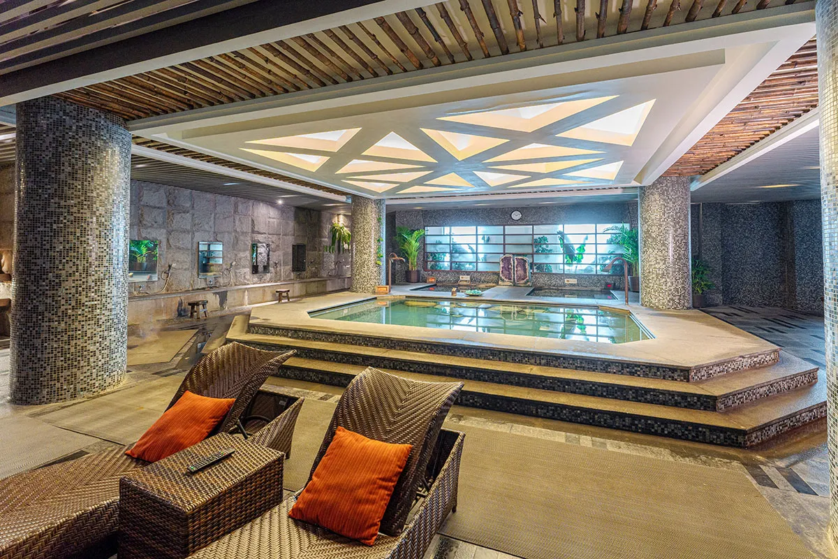 Indoor hot spring pool area reserved for guests staying at Riyuegu Hotsprings Hotel.